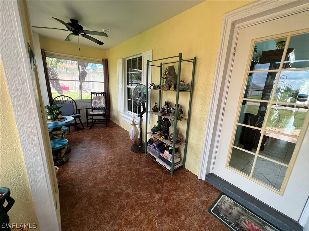 153 Patio Street Lehigh Acres, FL 33974 - Photo 3 of 27 a room with furniture and a window