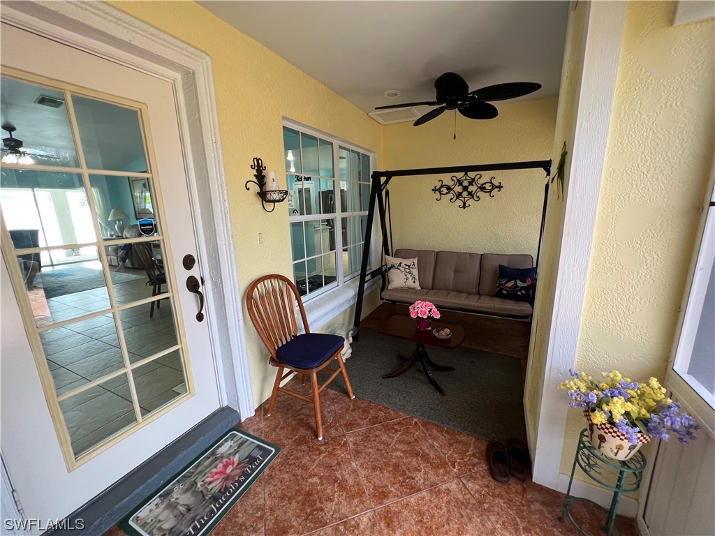 153 Patio Street Lehigh Acres, FL 33974 - Photo 4 of 27 a living room with furniture and a window