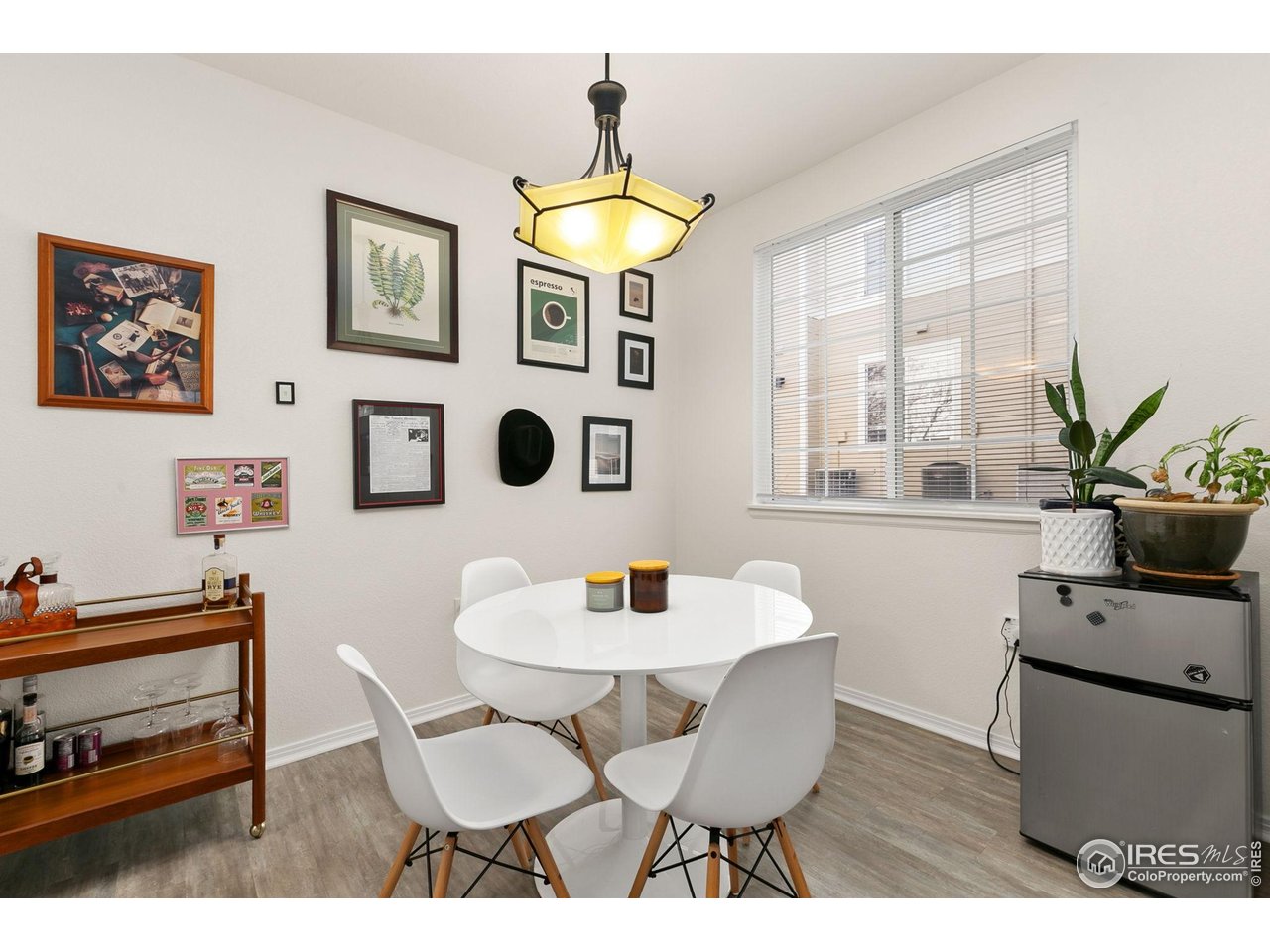 3002 West Elizabeth Street, Unit 1C Fort Collins, CO 80521 - Photo 4 of 15 a dining room with furniture and window