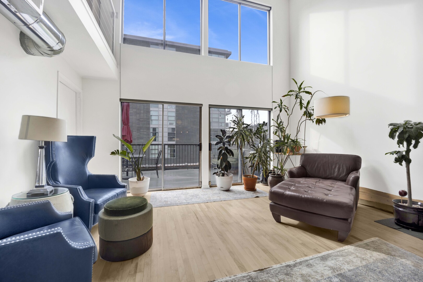 203 South Sangamon Street, Unit 310 Chicago, IL 60607 - Photo 12 of 34 a living room with furniture and a potted plant