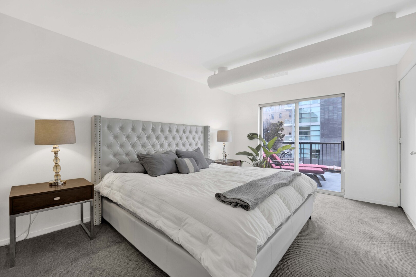 203 South Sangamon Street, Unit 310 Chicago, IL 60607 - Photo 17 of 34 a bedroom with a bed and a window