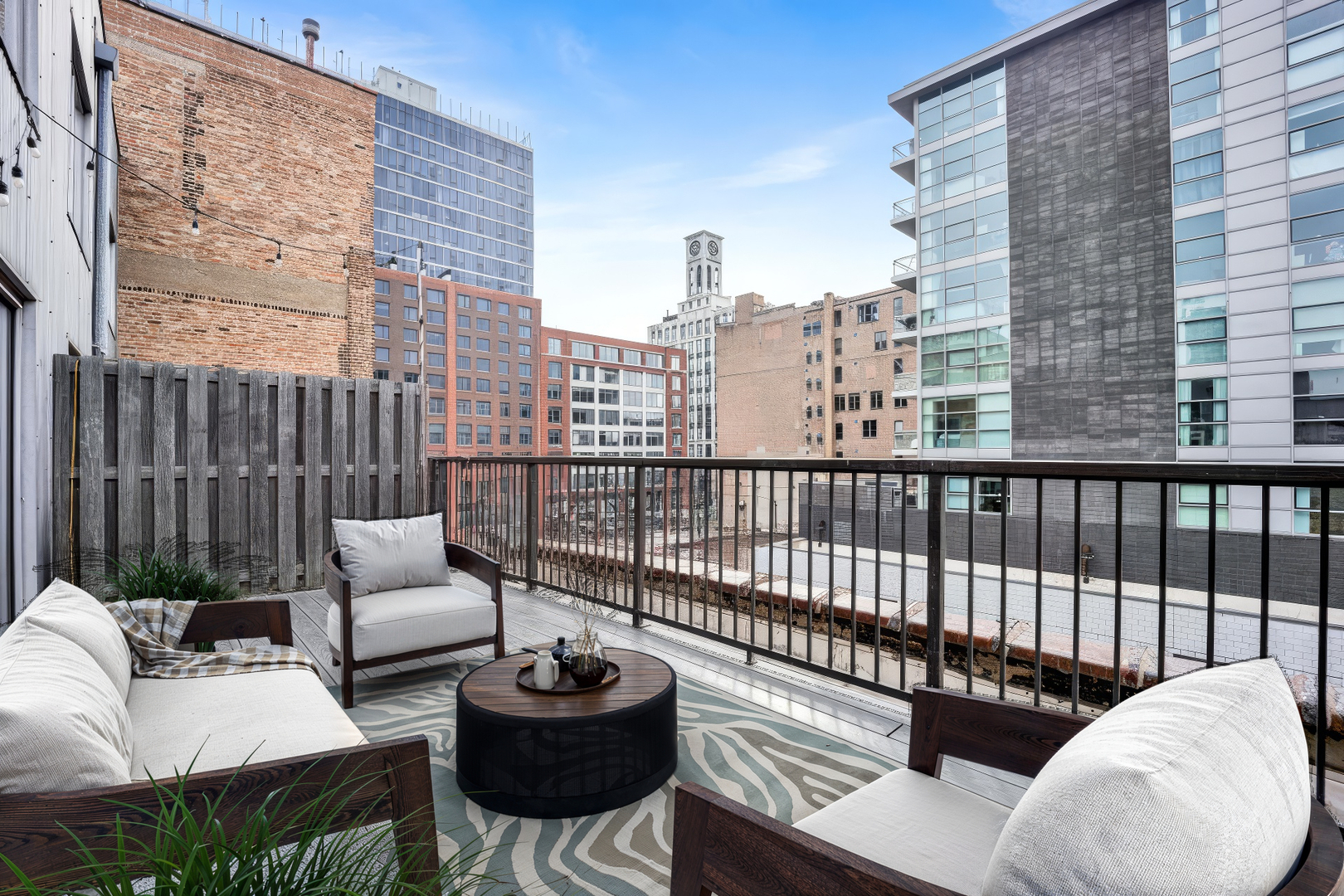203 South Sangamon Street, Unit 310 Chicago, IL 60607 - Photo 25 of 34 a view of a roof deck with couches