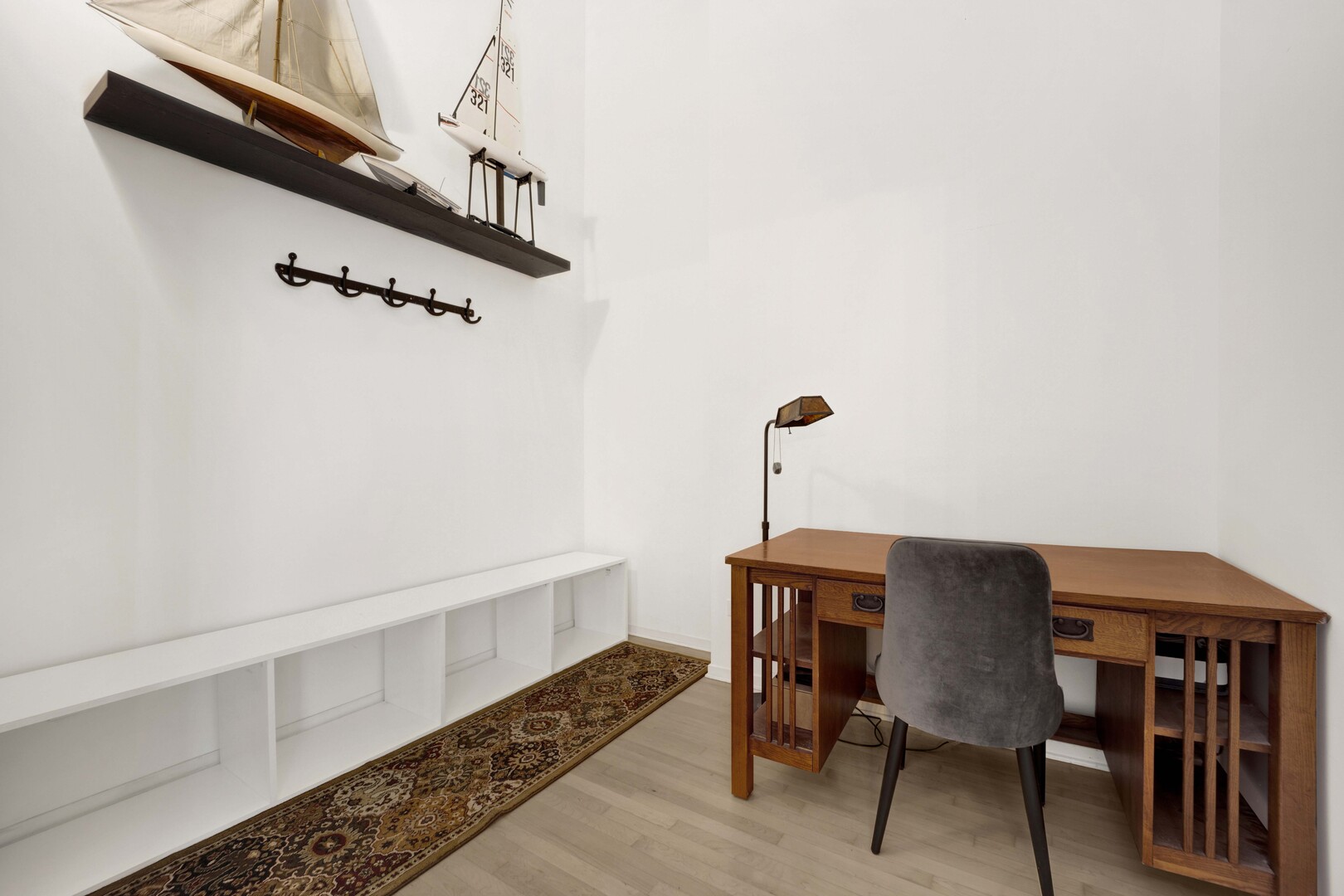 203 South Sangamon Street, Unit 310 Chicago, IL 60607 - Photo 8 of 34 a view of a room with furniture and wooden floor