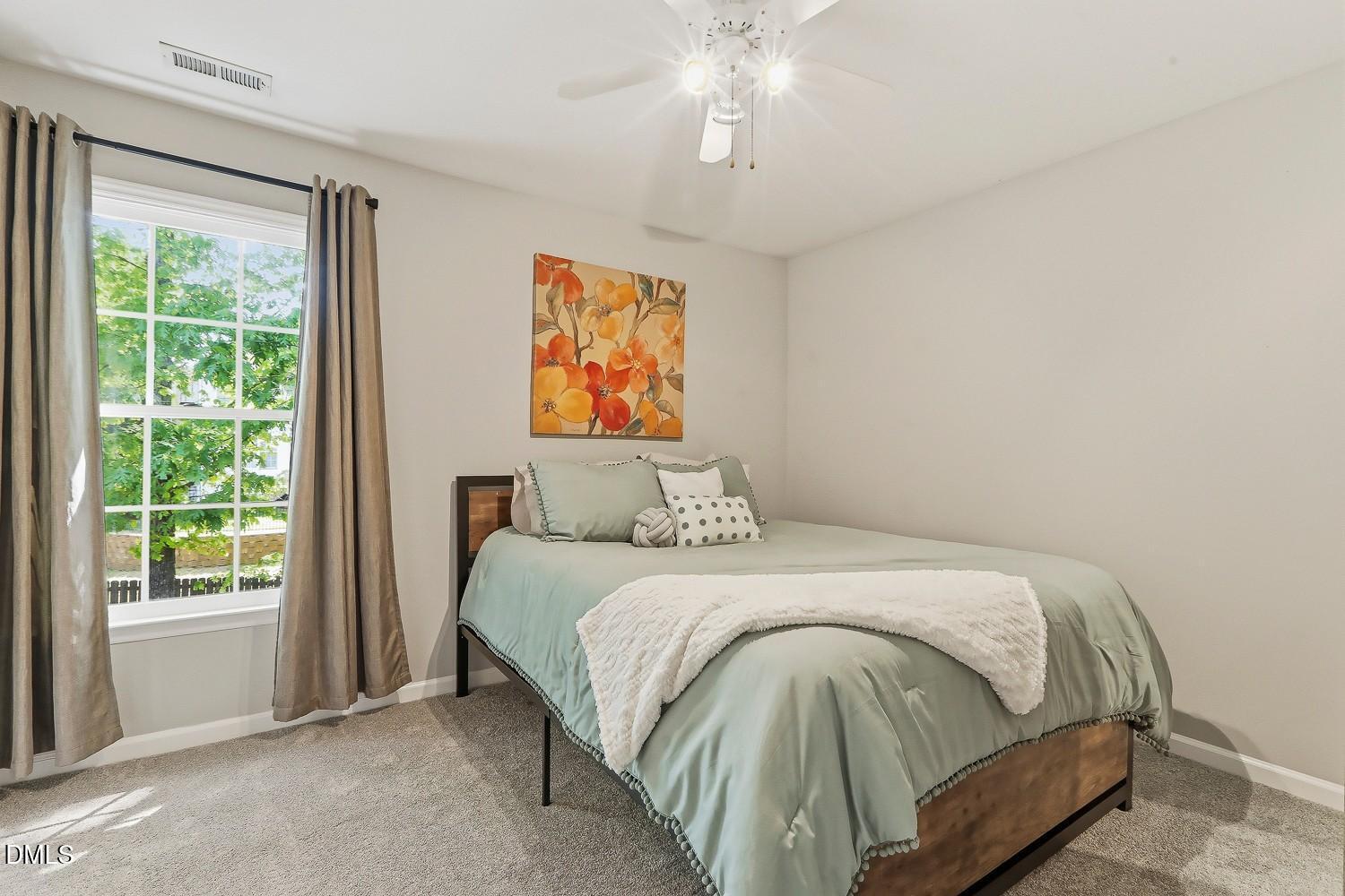 4001 Batiste Road Raleigh, NC 27613 - Photo 34 of 63 a bedroom with a bed and a window