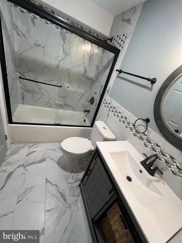 a bathroom with a sink and mirror