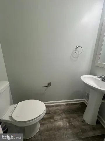 a bathroom with a toilet and a sink