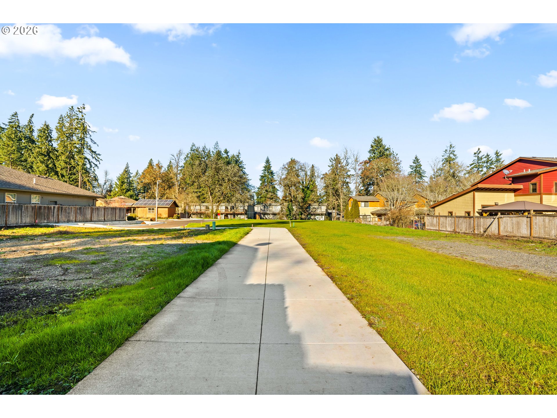 Cal Young Road Eugene, OR 97401 - Photo 6 of 15 a view of swimming pool with outdoor seating and trees in the background
