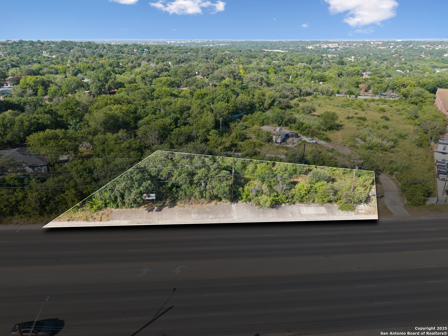 2259 Bandera Road San Antonio, TX 78228 - Photo 2 of 11 a view of a large yard with a patio