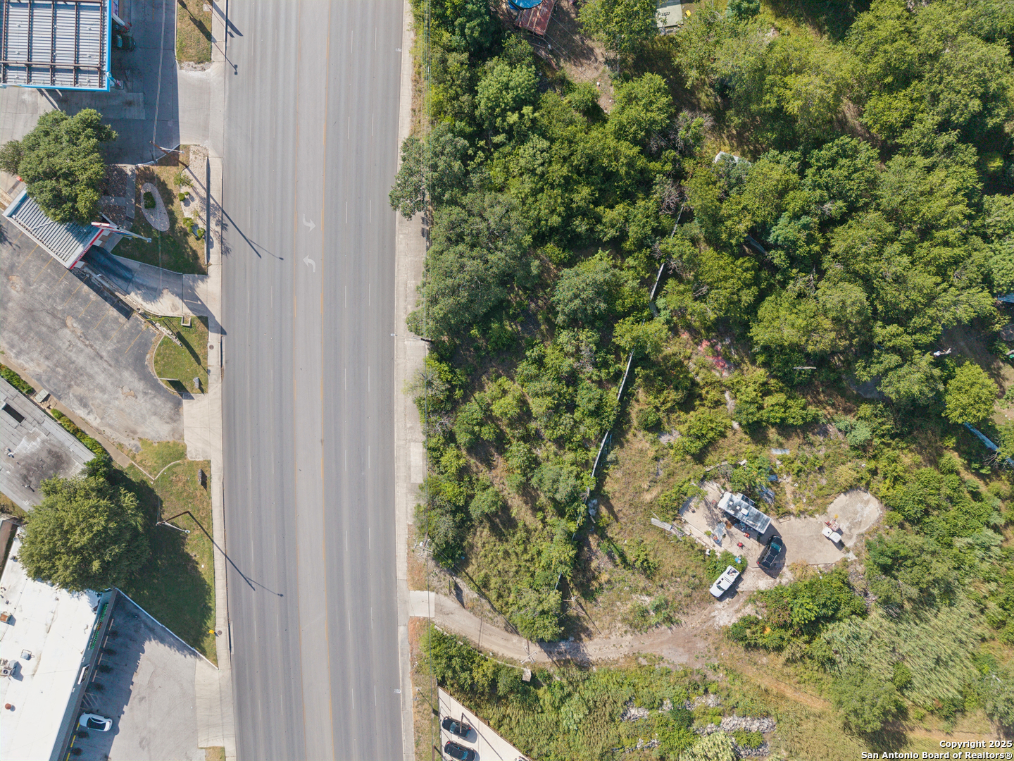 2259 Bandera Road San Antonio, TX 78228 - Photo 9 of 11 a view of a yard with plants and flowers