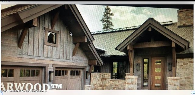 an aerial view of residential house and outdoor space