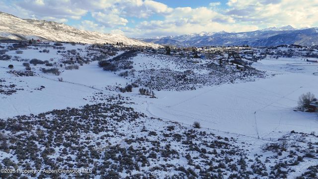a view of a lake with mountain in the background