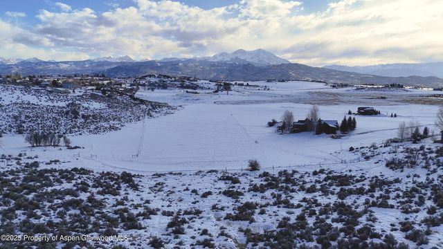 a view of a big yard with lots of green space