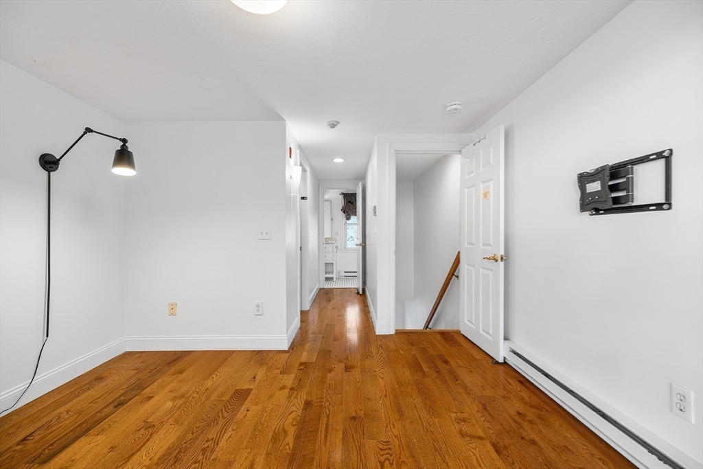 544 Shore Road, Unit 3 Truro, MA 02666 - Photo 29 of 30 a view of empty room with wooden floor