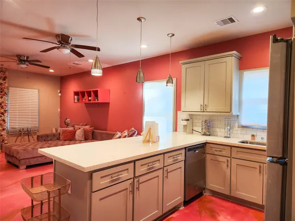 a kitchen with a sink and cabinets