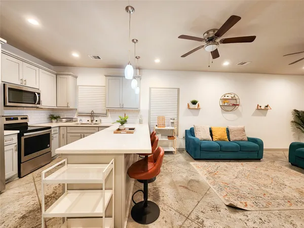 a large kitchen with cabinets