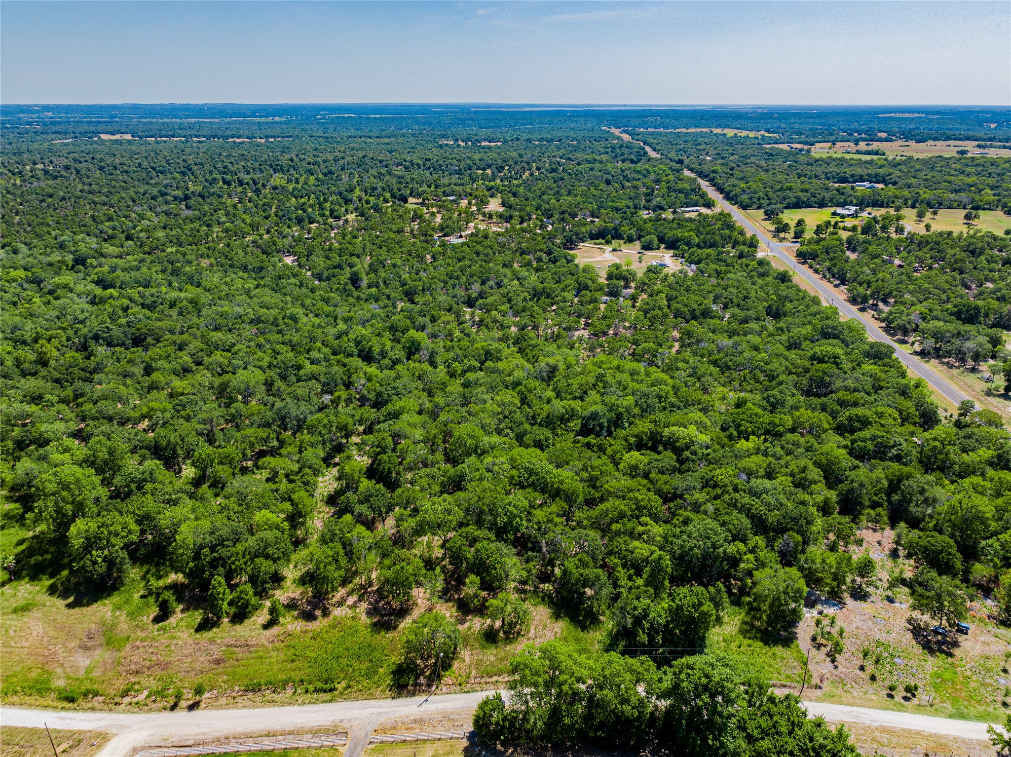 4016 Rd Snook Tx 77878 Road Somerville, TX 77879 - Photo 3 of 18 an aerial view of residential houses with outdoor space and trees