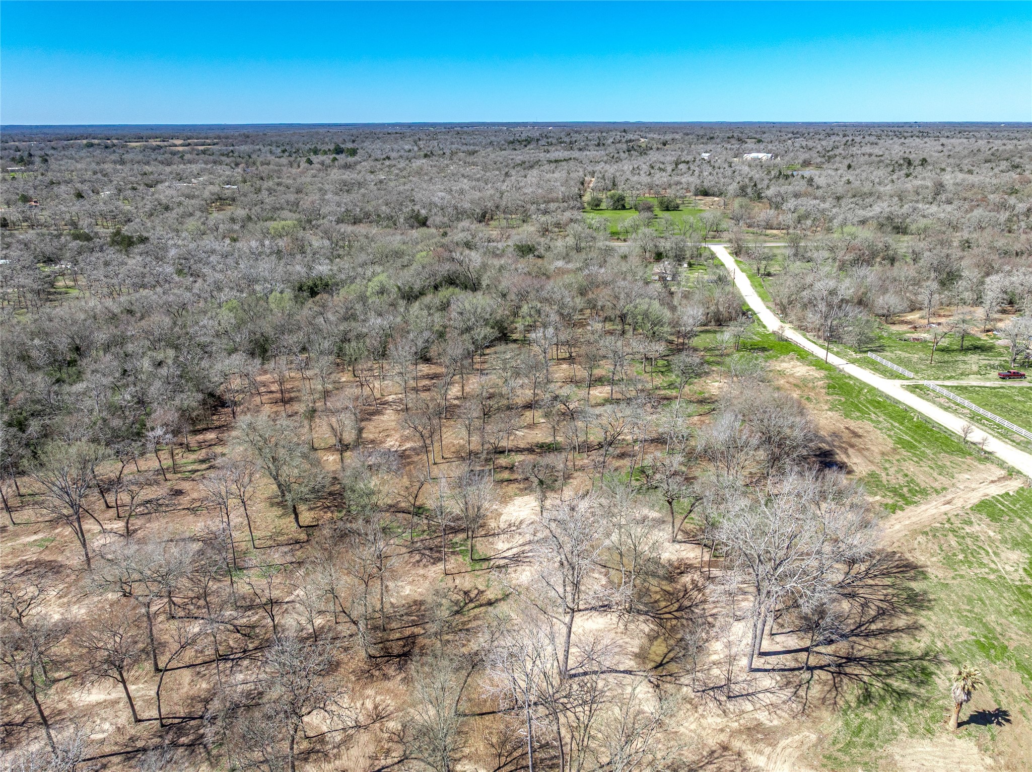 4016 Rd Snook Tx 77878 Road Somerville, TX 77879 - Photo 7 of 18 a view of a dry yard with wooden fence