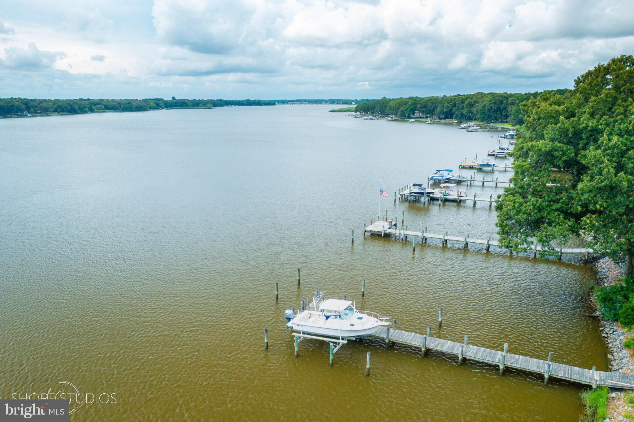 26933 Mallard Road Chestertown, MD 21620 - Photo 5 of 15 a view of a lake with a table and chairs