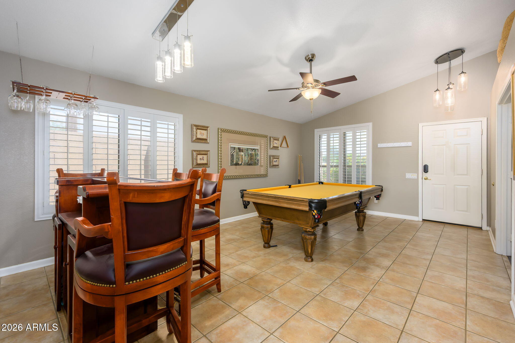 3136 East Roveen Avenue Phoenix, AZ 85032 - Photo 26 of 38 a living room with furniture a dining table and a large window