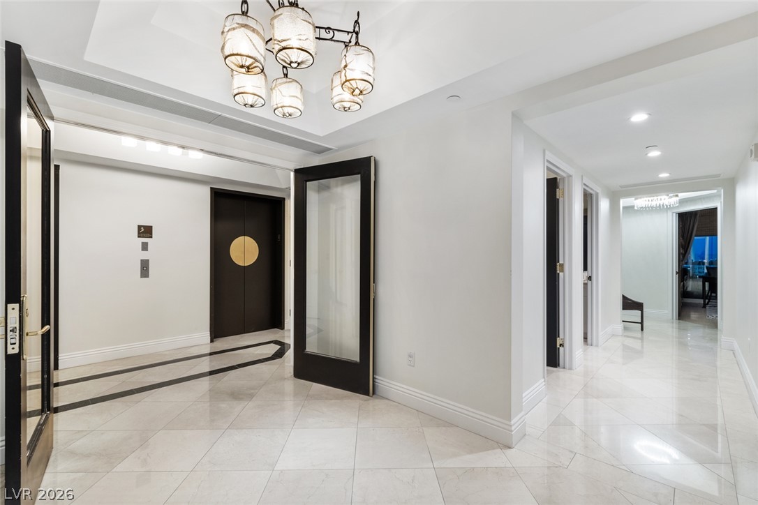 2857 Paradise Road, Unit 602 Las Vegas, NV 89109 - Photo 31 of 33 Polished tile flooring guides guests from the elevator directly into this elegant reception foyer.