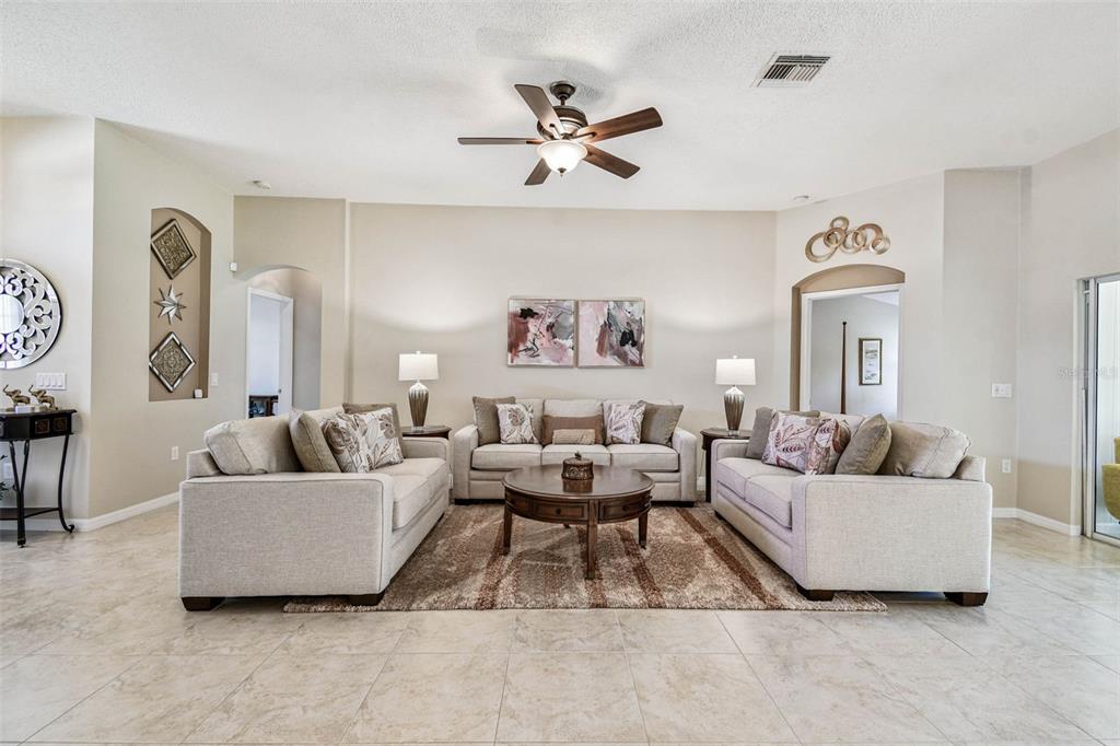 12202 Aaron Terrace Trinity, FL 34655 - Photo 7 of 41 a living room with furniture and a large window