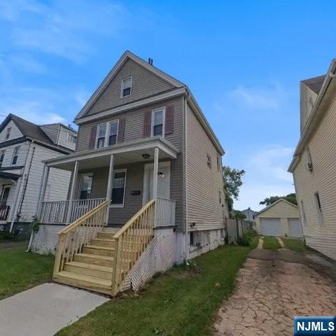 167 James Street Hackensack, NJ 07601 - Photo 2 of 30 a front view of a house with a yard