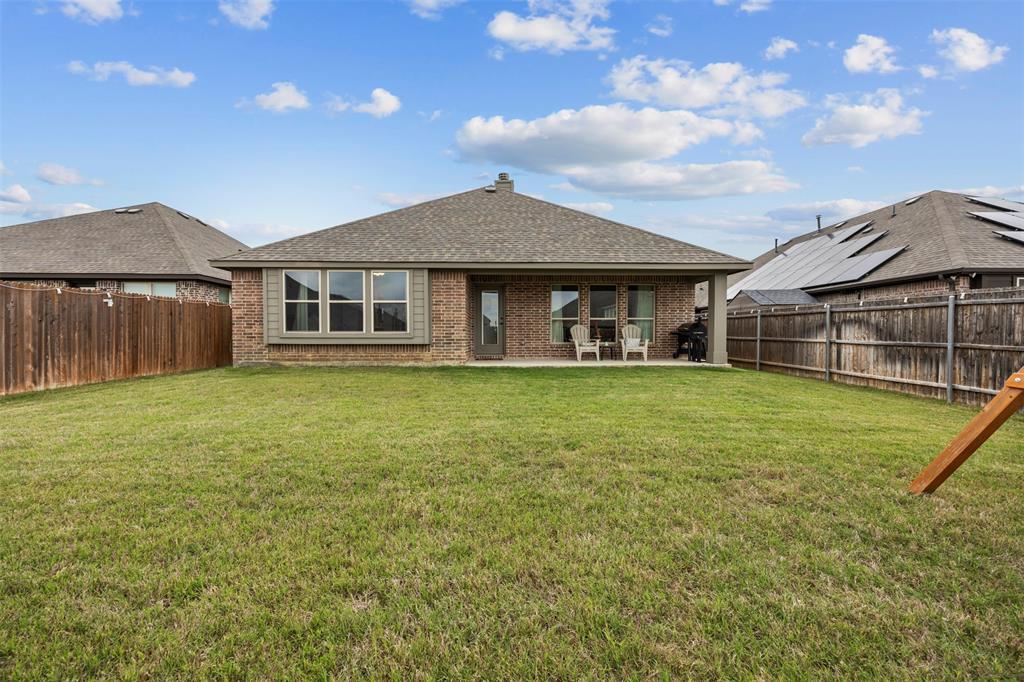 1084 Imperial Eagle Road Alvarado, TX 76009 - Photo 32 of 39 a front view of a house with a garden and lake view