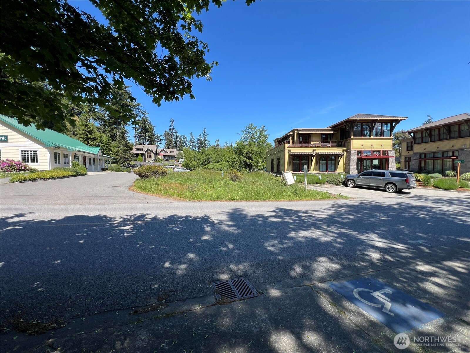 0 Main Street South Orcas Island, WA 98245 - Photo 14 of 18 a front view of a building with trees and umbrellas