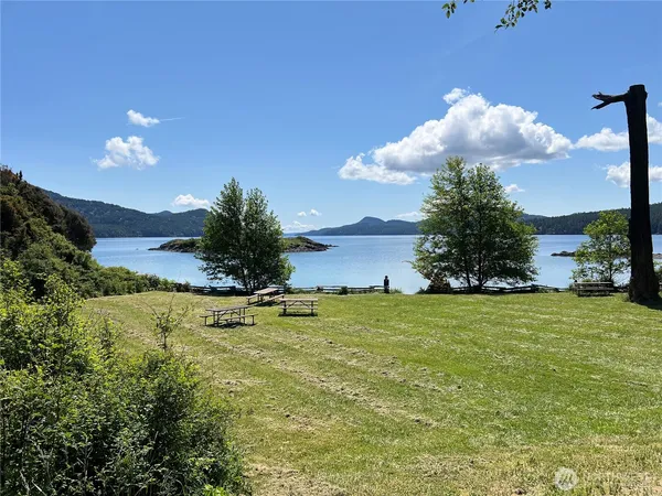 a view of a lake with a yard