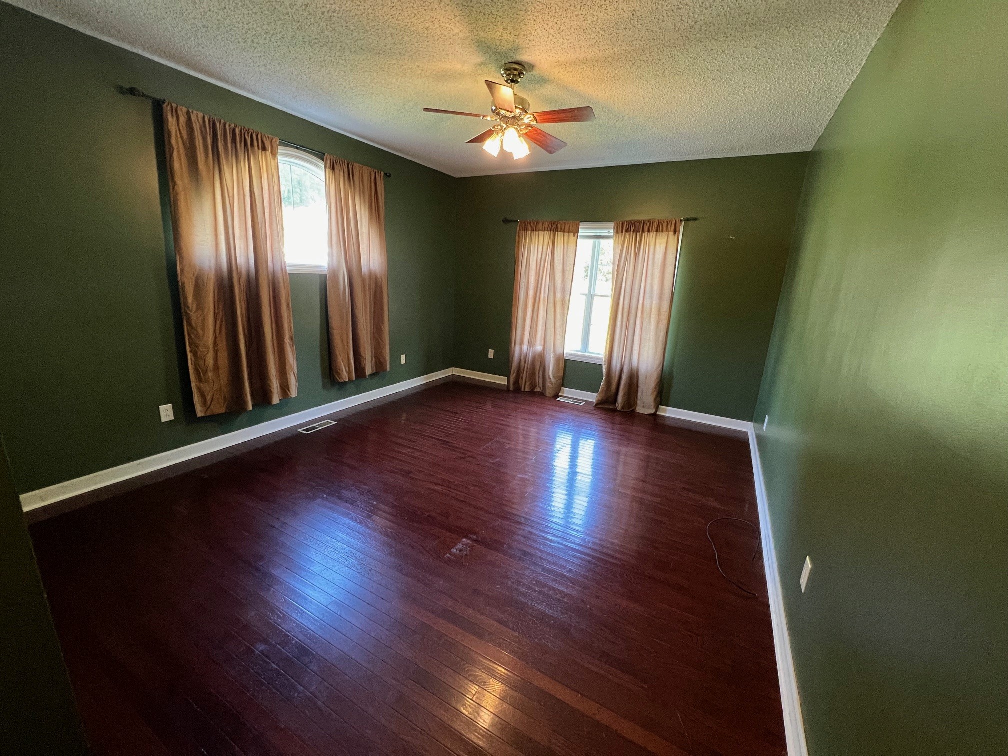 1400 Sumac Road Pulaski, TN 38478 - Photo 17 of 49 an empty room with wooden floor and windows