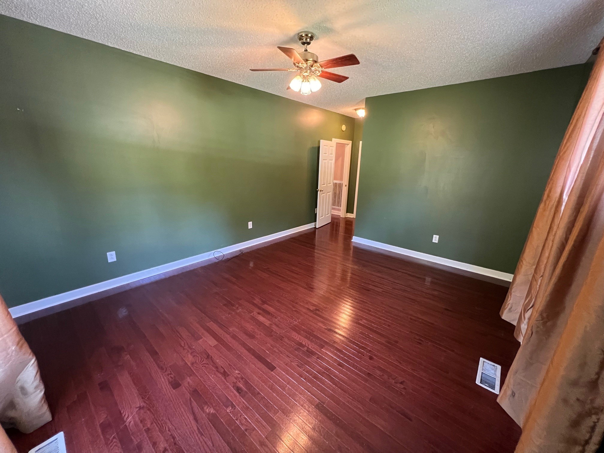 1400 Sumac Road Pulaski, TN 38478 - Photo 18 of 49 a view of an empty room with window and wooden floor