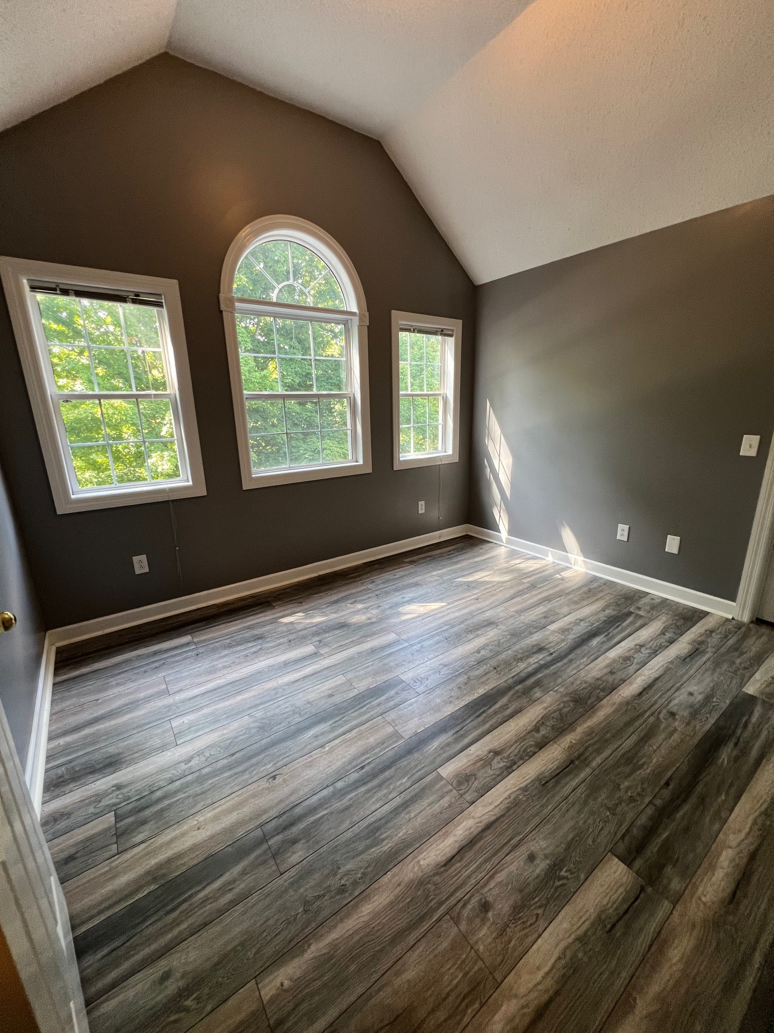 1400 Sumac Road Pulaski, TN 38478 - Photo 22 of 49 a view of an empty room with wooden floor and a window
