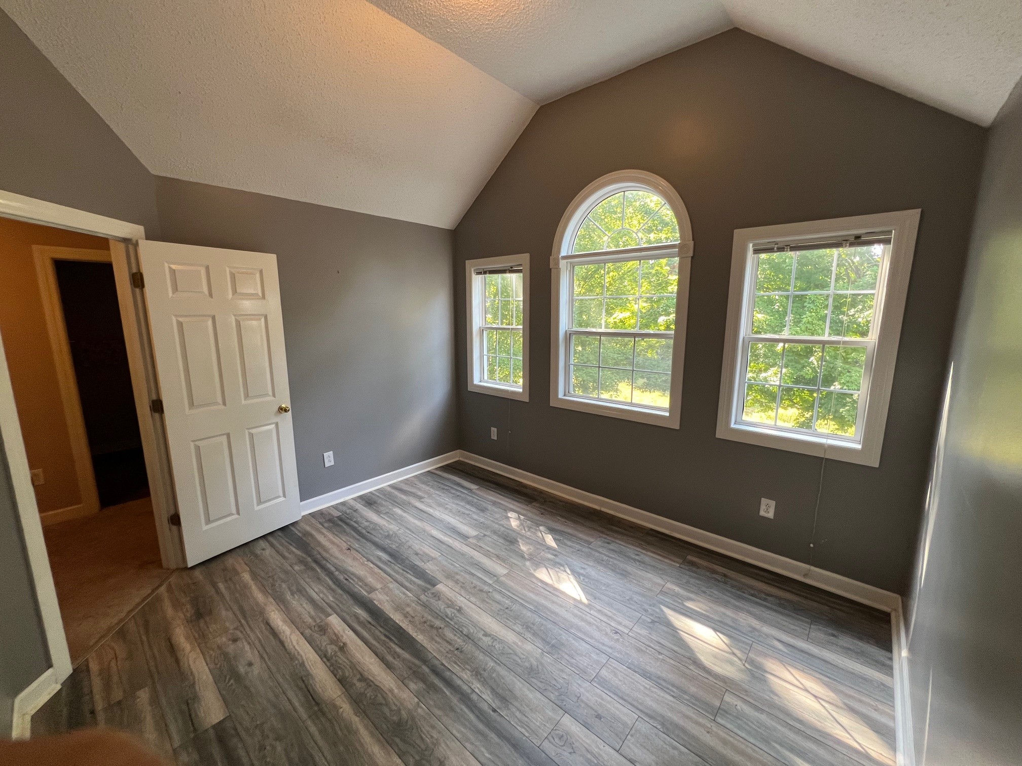 1400 Sumac Road Pulaski, TN 38478 - Photo 24 of 49 a view of an empty room with wooden floor and a window