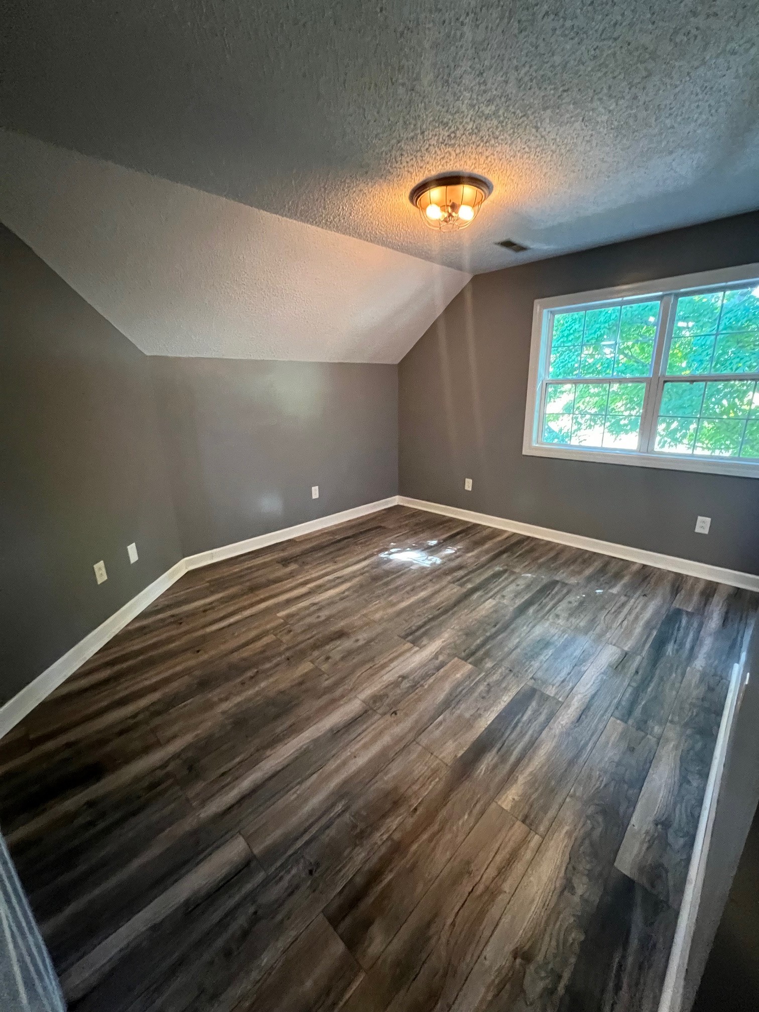 1400 Sumac Road Pulaski, TN 38478 - Photo 26 of 49 a view of empty room with wooden floor and fan