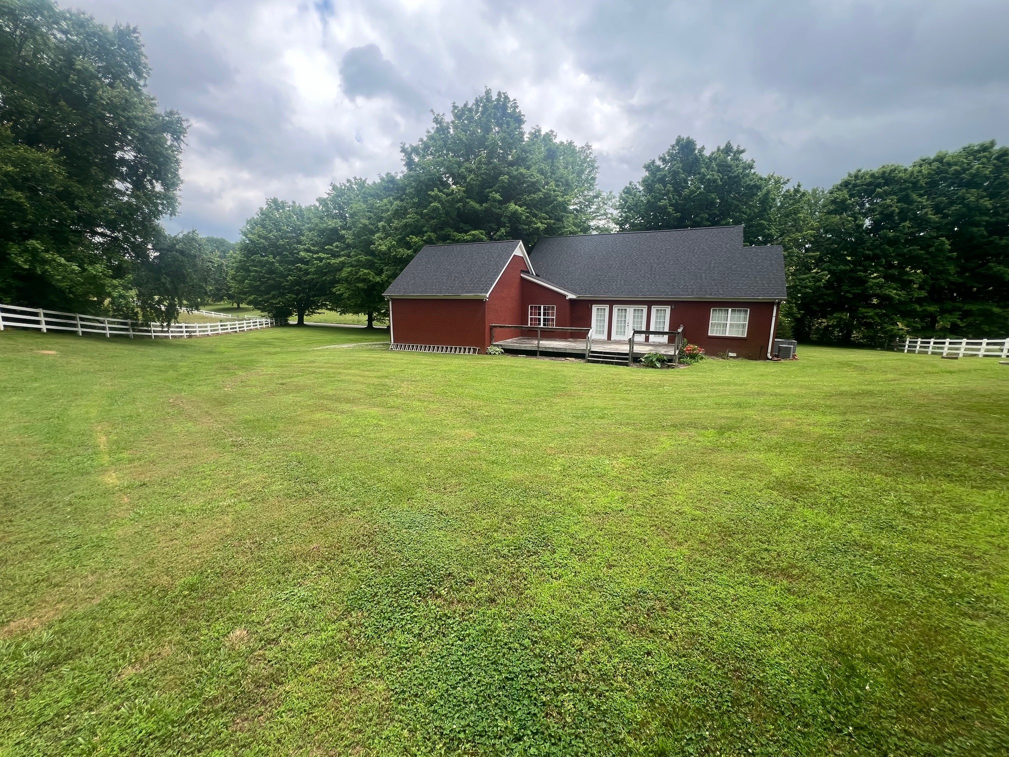 1400 Sumac Road Pulaski, TN 38478 - Photo 39 of 49 a front view of house with yard and trees in the background