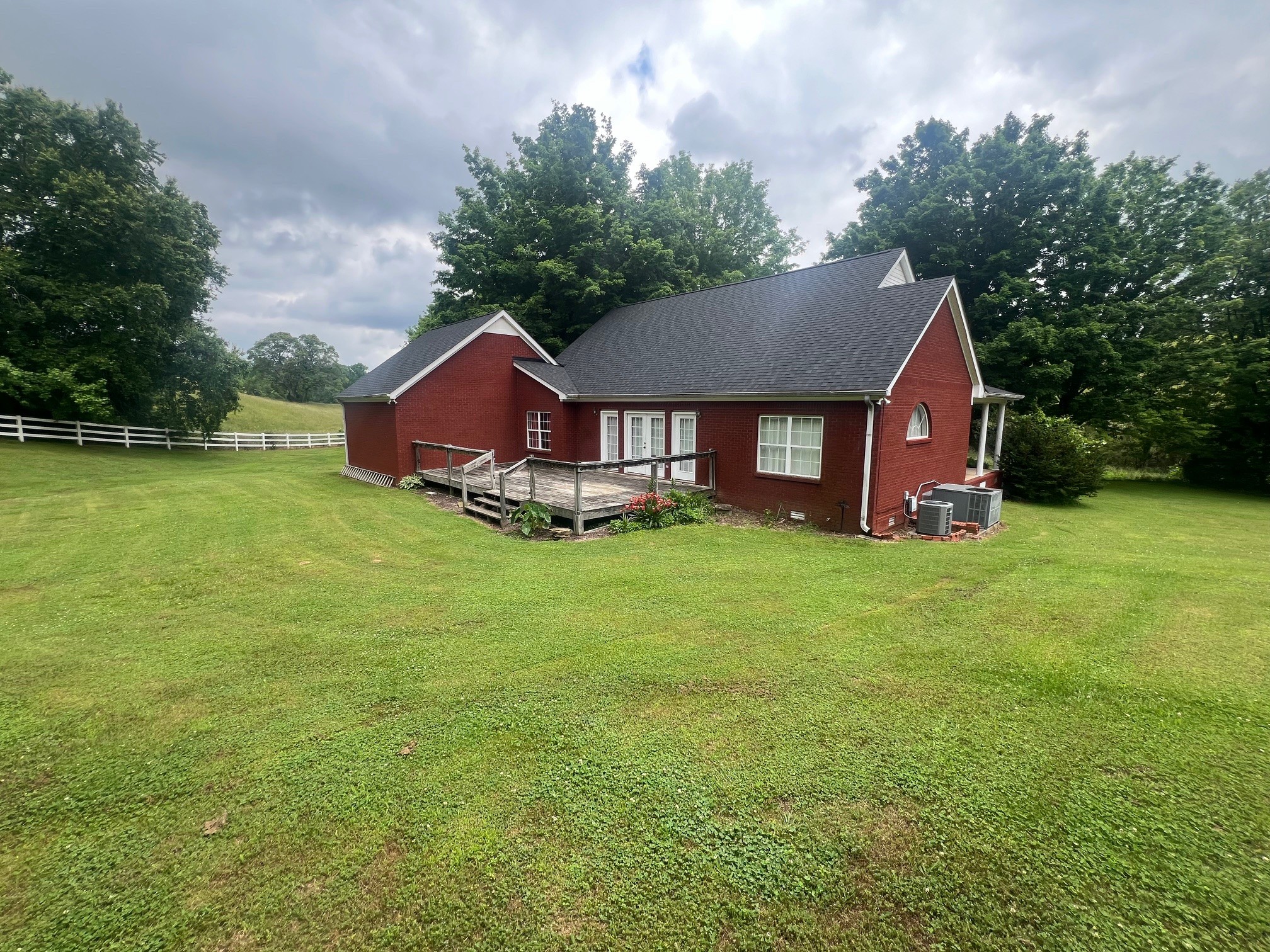 1400 Sumac Road Pulaski, TN 38478 - Photo 44 of 49 a aerial view of a house with a yard and large trees