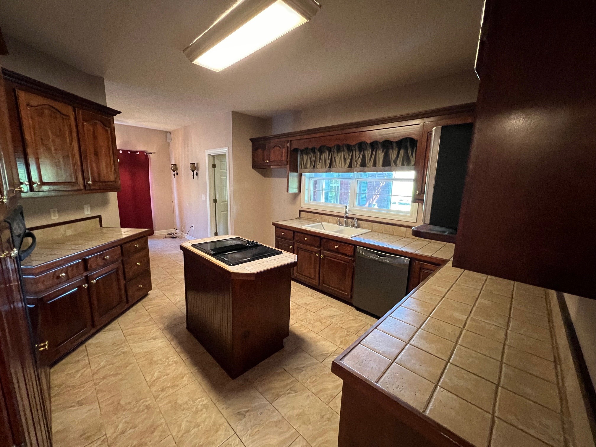1400 Sumac Road Pulaski, TN 38478 - Photo 7 of 49 a kitchen with stainless steel appliances kitchen island granite countertop a stove a sink and a microwave