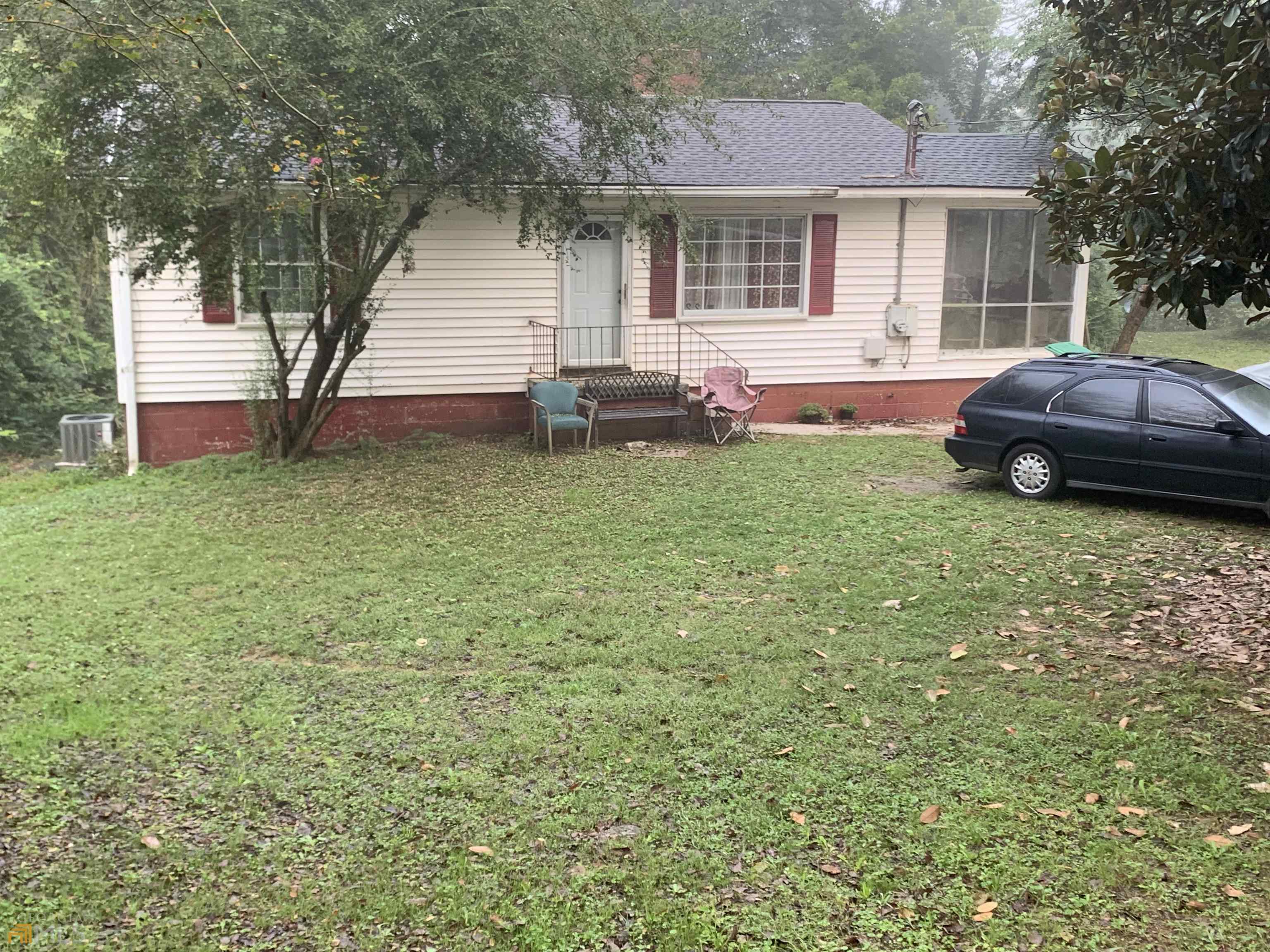 22 Blacks Bluff Road Southwest Rome, GA 30161 - Photo 1 of 1 a house view with a garden space