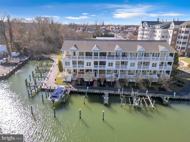 a view of roof deck with dining table and chair