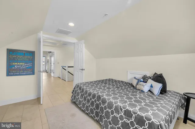 a view of a balcony with furniture and a floor to ceiling window