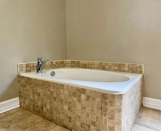 a bath tub sitting next to a sink