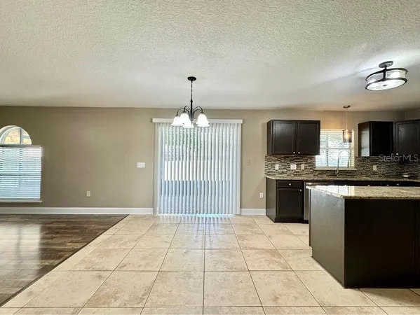 a view of a kitchen with microwave and stove