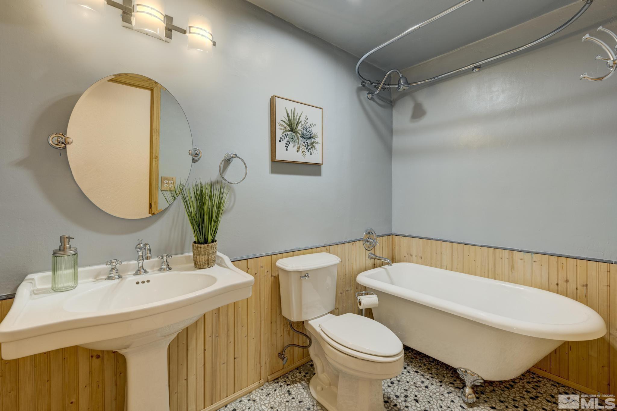 14640 Toll Road Reno, NV 89521 - Photo 16 of 40 a bathroom with a sink toilet and a mirror
