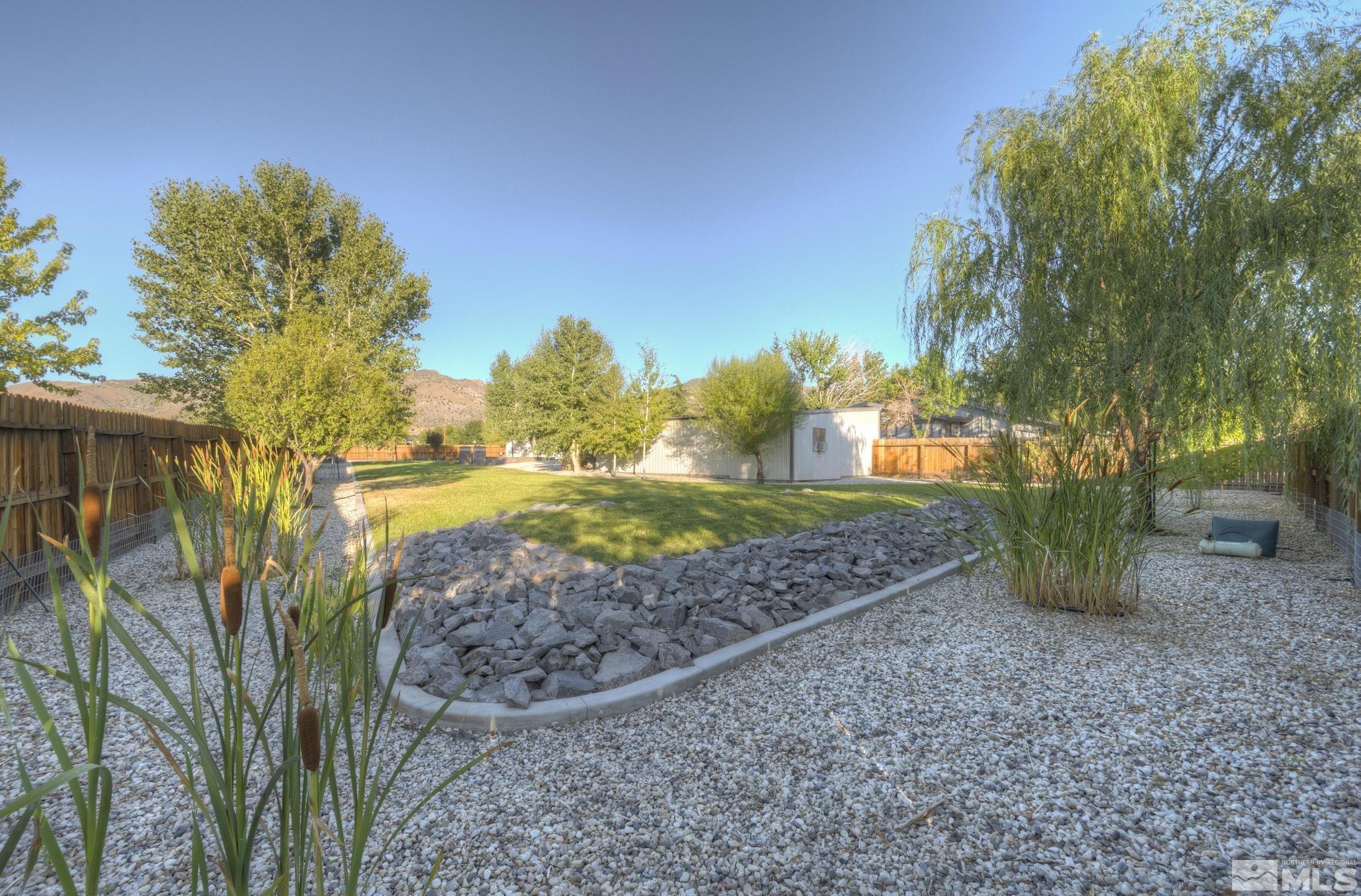 14640 Toll Road Reno, NV 89521 - Photo 29 of 40 a view of a garden with large trees
