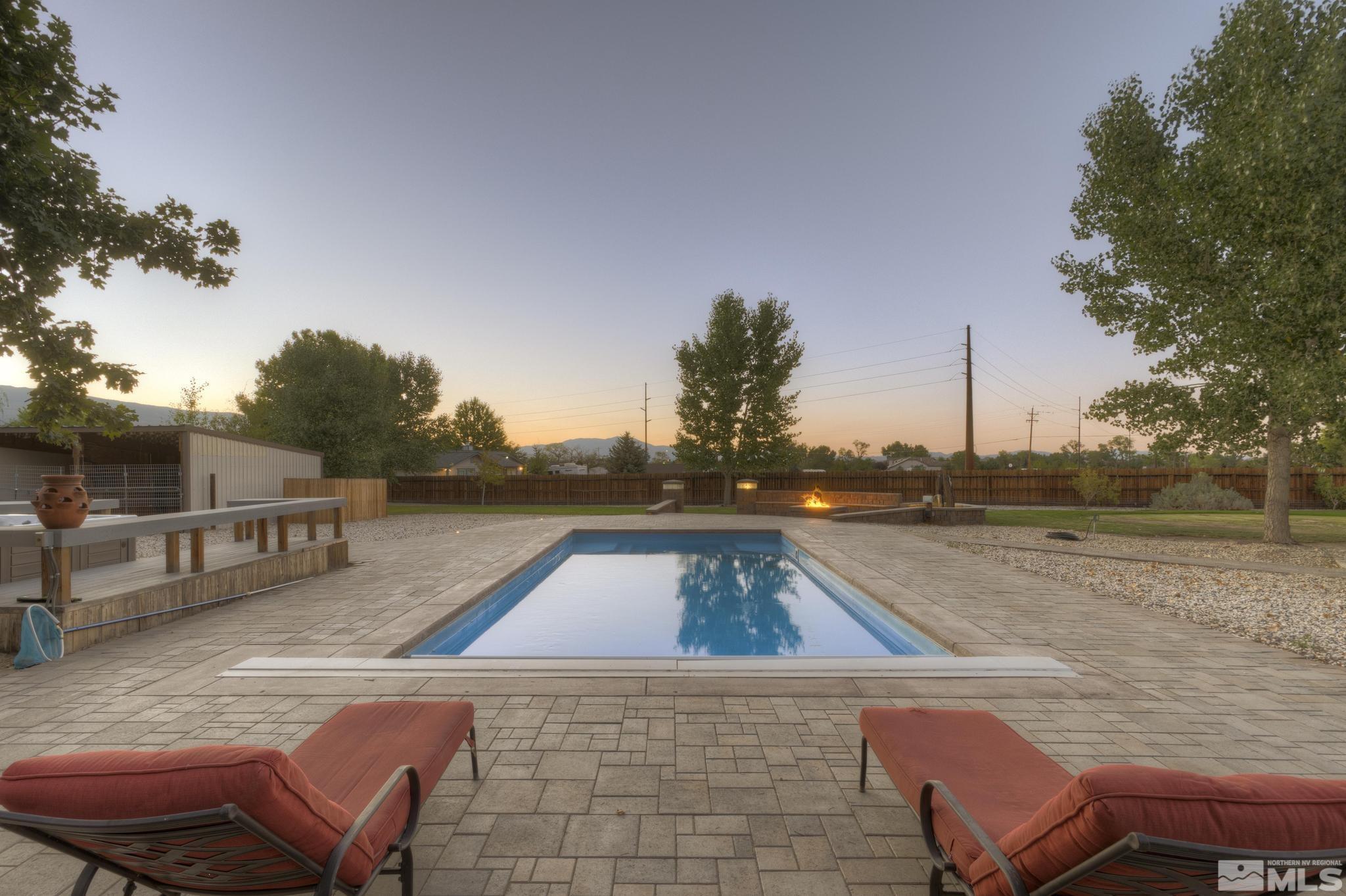 14640 Toll Road Reno, NV 89521 - Photo 4 of 40 a view of a swimming pool with a lounge chair