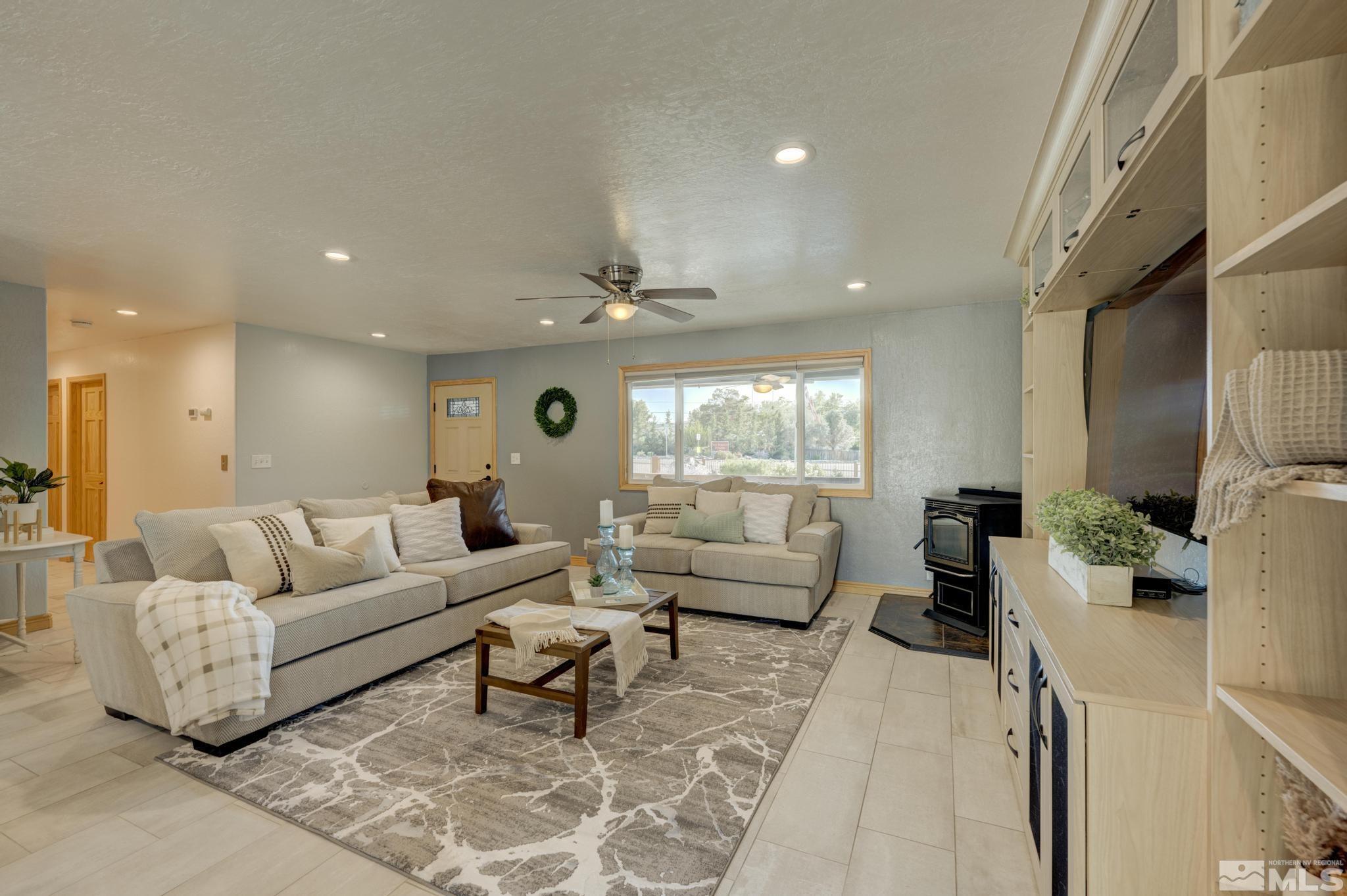 14640 Toll Road Reno, NV 89521 - Photo 8 of 40 a living room with furniture and a large window
