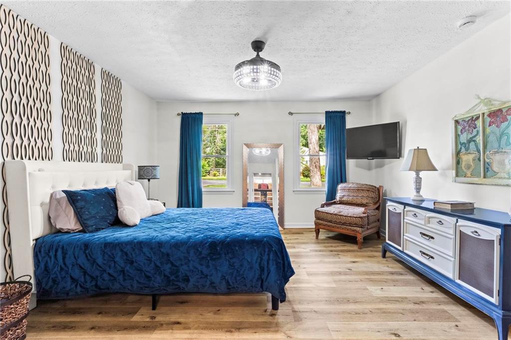 6971 Recreation Lane Acworth, GA 30102 - Photo 12 of 23 a bedroom with a bed and wooden floor