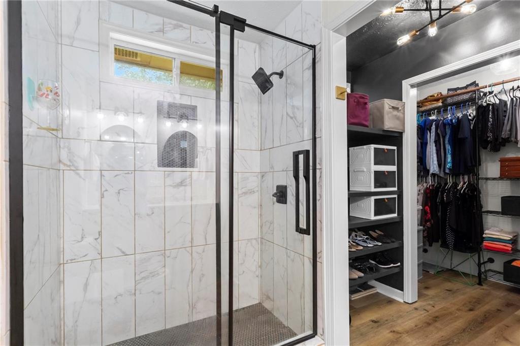 6971 Recreation Lane Acworth, GA 30102 - Photo 15 of 23 a view of walk in closet with clothes and shoes