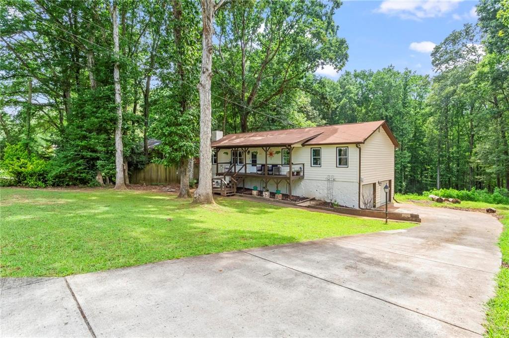 6971 Recreation Lane Acworth, GA 30102 - Photo 2 of 23 a view of a house with a yard and sitting area