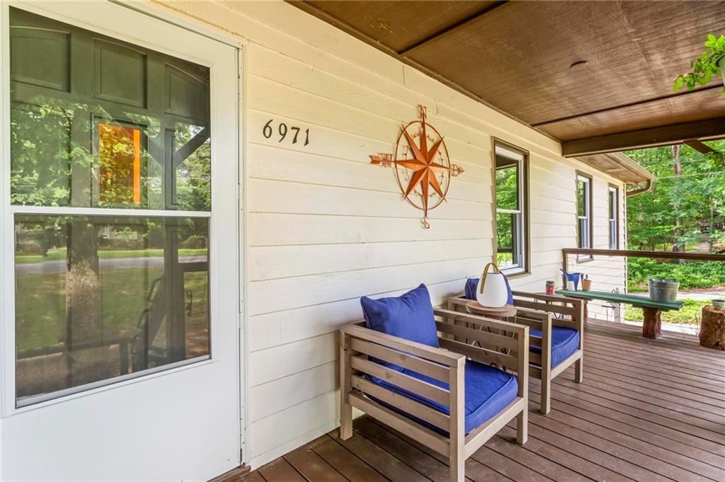 6971 Recreation Lane Acworth, GA 30102 - Photo 3 of 23 a view of balcony with wooden floor and furniture
